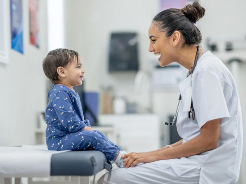 Image of a doctor treating a child