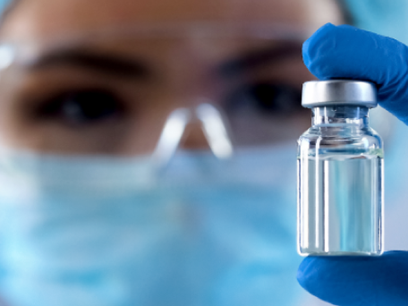 a doctor checking medicine bottle